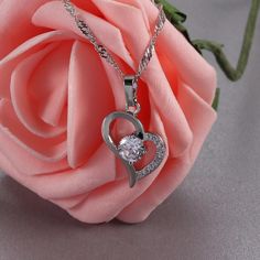 This Necklace Is A Diamond Cut Twisted Stainless Steel Chain Featuring A Sparkly Heart Pendant With 9 Small Cubic Zirconia And 1 Large, About 1 Carat At The Center Brand New Never Worn Chain Length 18” Can’t Afford A Diamond Well This Perfect And Makes A Great Gift For Your Special Person! Just As Sparkly As A Diamond, And Shhh No One Has To Know! Heart Cut Cubic Zirconia Necklace As Gift For Her, Heart Cut Cubic Zirconia Necklace For Her, Cubic Zirconia Heart Pendant Necklace With Clavicle Chain, Heart Pendant Necklace With Clavicle Chain In Cubic Zirconia, Cubic Zirconia Heart Pendant Necklace For Valentine's Day, Heart-shaped Cubic Zirconia Necklace For Her, Heart-shaped Cubic Zirconia Necklace Gift For Her, Valentine's Day Cubic Zirconia Heart Necklace With Clavicle Chain, Heart Cut Diamond Accents Necklace For Her