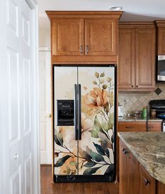 the refrigerator is decorated with flowers and leaves