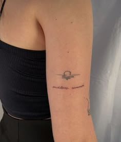 a woman's arm with a tattoo that reads, i love you to the moon and back