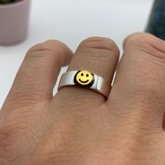 "**Spread Happiness with Our Smiley Face Ring!  🌞 **Radiate Positivity This smiley face ring is more than just jewelry; it's a symbol of joy and happiness. Gift it to your boyfriend or best friend to share smiles and good vibes. 🎁 **Ideal Christmas or Birthday Gift Looking for a unique Christmas or birthday gift for your boyfriend or best friend? This cool emoji ring is a thoughtful and fun present that's sure to brighten their day. 🌟 **Adjustable for Comfort Crafted with versatility in mind, this adjustable ring ensures a comfortable fit for any finger. Its simplicity and charm make it suitable for any occasion. ⭐ **Why Choose Our Smiley Face Ring - **Joyful Design A symbol of happiness and positivity. - **Perfect for Loved Ones Show your affection with this cool smiley ring. - **Versa Novelty Smiley Face Jewelry As Gift, Novelty Smiley Face Jewelry For Gifting, Novelty Smiley Face Jewelry For Gifts, Novelty Smiley Face Jewelry Gift, Adjustable Fun Rings For Gifts, Smiley Face Ring As Gift, Fun Handmade Rings For Gifts, Fun Handmade Rings As Gifts, Handmade Fun Rings As Gifts