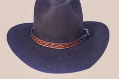 Custom Handmade Western Hat Band.  In Three colors of English Bridle and one saddle skirting London Tan, Brown, Black, Light Show, 3/4 x 28 with silver type buckle set all Hand rubbed and Painted edges. Highlighted Tooling and top coated. NOTE: I am not a store or a factory, I carry only a limited inventory of products.  I am a custom handcrafted leather shop, which means I don't make any products until you buy it, one at a time no two items are ever completely the same, what I show in my ads is what we can do, and the door is open for you to tell me what you want on your item.  Just because it is not shown is no sign, we can't make it   Just tell me what you want to be done and we can almost always change anything from the color of the thread to your ranch logo, Brand, your name, or anyth Western Style Brown Hat Bands For Formal Occasions, Custom Brown Hat Bands For Ranch, Classic Brown Hat Bands For Riding, Classic Handmade Adjustable Hat Bands, Artisan Fitted Brown Hat Bands, Artisan Brown Fitted Hat Band, Artisan Brown Hat Band, Adjustable Country Hat Bands For Riding, Adjustable Brown Hat Bands For Riding