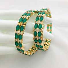 "Green emerald bangles,Bridal Sabyasachi emerald bangles,Bollywood Indian Wedding Jewelry,Emerald openable bangles@AryaFashions in size 2.4, 2.6,2.8 This bangles set is handcrafted with love and creativity and are perfect for any occasion may it be engagement, Wedding or any bridal ceremonies or social get-together. These handcrafted beautiful high quality bangles are made in brass alloy metal with traditional Jadau handwork and are lined with fine lustrous stones. Pair them up with Indian tradi Green Bangle Bracelets For Wedding, Green Bangle For Formal Festivals, Green Bangle For Formal Events And Festivals, Temple Jewelry Style Green Bangle With Meenakari, Green Meenakari Bracelets For Festivals, Green Meenakari Bangle For Wedding, Traditional Green Bangle For Festivals, Traditional Green Bracelets For Party, Wedding Green Meenakari Bangle