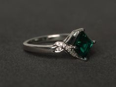 Welcome to my shop, you can find many beautiful gemstone jewelry here, and you also can ask for customized service. Main Stone: lab emerald, square cut, measures 7x7mm, weights about 1.62 caratsAccent Stones: czMetal: 925 sterling silver plated with rhodium. I also can provide metal options such as 14k solid yellow/white/rose goldSetting: prong settingmore rings: https://www.etsy.com/shop/XCjewelryStudio?ref=hdr_shop_menuIt's a perfect gift for the person who was born in May (Birthstone), it's q Emerald Rings With Accent Stones Princess Cut, Promise Emerald Cut Emerald Ring With Accent Stones, Emerald Ring With Princess Cut And Accent Stones, Classic Emerald Birthstone Ring With Accent Stones, Elegant Sterling Silver Princess Cut Emerald Ring, Elegant Emerald Promise Ring For May Birthstone, White Gold Emerald Birthstone Ring With Center Stone, Elegant Princess Cut Emerald Ring In Sterling Silver, Emerald Princess Cut Ring With Center Stone