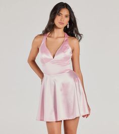 Bring glamour to the school dance in the Taylor satin party dress made to wow! The satin fabric adds a luxurious touch to your night. With a V-neckline, padded bra cups, shoulder straps, and a lace-up back, this dress highlights your figure in a skater silhouette and short-length hem. Compliment your look with a gorgeous hair accessory, bracelet, and heels!Fit & FeaturesSatin fabric, bust knit lining, minimal stretchV-necklinePadded bra cupsShoulder strapsLace-up back, lower zipper and hook- Flirty V-neck Homecoming Dress, Satin V-neck Halter Dress For Evening, Fitted Satin V-neck Mini Dress, Satin V-neck Cocktail Dresses, Flirty Sleeveless V-neck Dress For Party, Stretch V-neck Mini Dress For Prom, Pink V-neck Mini Dress For Prom, Summer Party V-neck Dress With Fitted Bodice, Satin V-neck Mini Dress For Prom