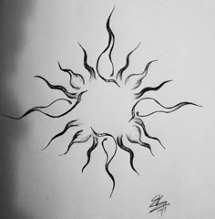 a black and white drawing of a sun