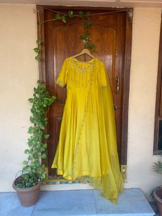 Hand embroidered Anarkali with embroidery organza dupatta / anarkali suit set / anarkali dupatta USA / chanderi dress with embroidered net dupatta / Indian dresses/ voggish / haldi yellow dress         Looking for a perfect indian dress/anarkali/suit sets that are trendy, unique and easy to carry !! yess, You are at the right place. we carry such versatile pieces of anarkalis and suit sets that really let you stand out in any occassion !!      featuring this beautiful chanderi dress in yellow co Yellow Anarkali Unstitched Suit With Sheer Dupatta, Yellow Lehenga With Zari Work In Maxi Length, Festive Yellow Cotton Silk Salwar Kameez, Yellow Silk Churidar With Zari Work, Yellow Cotton Silk Unstitched Suit For Diwali, Designer Yellow Unstitched Suit With Dupatta, Yellow Cotton Silk Dupatta With Dabka Work, Yellow Chanderi Salwar Kameez For Eid, Yellow Anarkali Churidar With Resham Embroidery