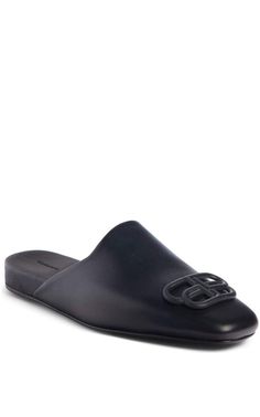 These black Balenciaga BB logo leather slipper shoes feature a square toe, slip-on design, flat sole and BB logo plaque.Calfskin leather with leather soleRubber tap heelMatte black-tone BB logo detail Composition: Leather 100%Lining Composition: Leather 100%Sole Composition: Leather 100% Fits true to sizeMade in Italy Chevron Jewelry, Bb Logo, Black Balenciaga, Gucci Shop, Balenciaga Black, Luxury Women Fashion, Leather Slippers, Shoes Flats Sandals, Slipper Shoes