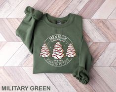 Farm Fresh Christmas Tree Cakes Shirt,Christmas Cake Sweatshirt,Christmas Tree Farm Shirt,Funny Christmas Sweatshirt,Christmas Tree Cake Tee Sizing and Color Information: Our shirts are custom-made just for you, so we cannot accept returns or exchanges. To get the best fit, please review our color and size charts before placing your order. If you have any questions about sizing or colors, feel free to contact us for clarification.  (If you need a 4XL T-Shirt, please let us know and we would like Christmas Tree Cake Shirt, Christmas Tree Cakes, Unique Christmas Gift Ideas, Etsy Best Sellers, Tree Cake, Christmas Tree Cake, Fresh Christmas Trees, Christmas Tree Shirt, Tree Cakes