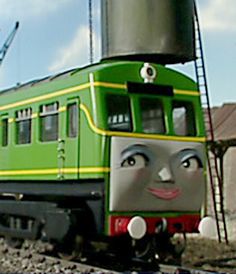 a green train with a face painted on it