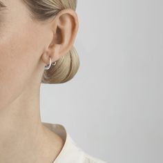 It is the unexpected twists and turns in life that truly define us, and the Mercy swirl earring is an emotional reminder of just that. The shape of the earring captures and symbolises the essence of time’s constant flow, and the way the earring seemingly hugs the earlobe makes us ever mindful from its touch on the skin. American designer Jacqueline Rabun strives to make her jewellery at one with the wearer. Her inspiration is often emotional, and she has a design language that features sculptura Georg Jensen Jewelry, Georg Jensen Silver, Grape Earrings, Contemporary Jewelry Design, Modernist Jewelry, Swirl Earrings, Spiral Earrings, Georg Jensen, The Unexpected