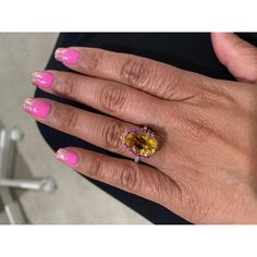 This gorgeous ring has a magnificent Pear Cut Citrine Quartz weighing 5.28 Carats and is surrounded by 25 Pink and Yellow Sapphires that weigh 0.60 carats and 20 Round Cut Diamonds that weigh 0.37 carats. (Clarity: SI, Color: F) The total carat weight of the ring is 6.25 carats. Each stone is handpicked and carefully curated to create a unique piece by our in-house designer and jeweler! The Citrine measures approximately at 11 mm x 16 mm. It is set in 14K White Gold and weighs approximately 3.8 grams. The ring is a size 7  Exact dimensions for this item are unknown. Please reach out in the seller Q&A for any questions on measurements. Dazzling Oval Multi-stone Gemstones, Luxury Multi-stone Yellow Gemstones, Luxury Yellow Pear-shaped Ring, Oval Multi-stone Gemstones, Luxury Yellow Multi-stone Gemstones, Fine Yellow Oval Sapphire Ring, Dazzling Oval Yellow Ring, Exquisite Oval Brilliant Cut Gemstones, Exquisite Oval Brilliant-cut Gemstones