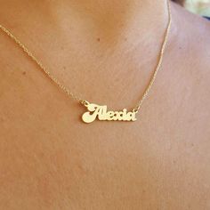 This elegant Personalized Name Necklace is the perfect way to celebrate your loved ones with a touch of gold. Crafted with care, this gold name necklace features a beautiful cursive design that adds sophistication and charm to any outfit. Whether you're looking for a gift for her, a Christmas gift, or a thoughtful Mother's Day gift, this necklace is an excellent choice. Perfect for moms, wives, or as a treat for yourself, the personalized name is delicately placed on a stunning gold necklace, ma Gold Name Necklace For Anniversary And Mother's Day, Gold Charm Necklace With Names For Birthdays, Gold Charm Necklace For Birthday With Names, Gold Jewelry With Names For Mother's Day, Mother's Day Gold Jewelry With Names, Gold Name Necklaces For Anniversary, Gold Charm Necklace With Names For Anniversary, Gold Charm Necklaces With Names For Anniversary, Gold Custom Name Necklace For Gift