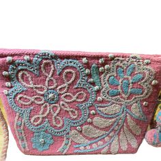 Our unique and beautiful hand embroidered "cosmetic bags" can be used to carry all your beauty essentials, perfect for daily use and ideal for travel; as well as convert to a Crossbody Bag. Made by female Artisans from Peru from hand loomed wool yarns, with hand embroidered coloful emblishements. Each tasseled bag has cotton lining and detachable matching wool braided strap. 11 1/2 "x 8" x 3" They are designed to be the perfect gift to make someone feel special! Handmade Pink Cosmetic Bag For Travel, Handmade Pink Bag For Personal Use, Rectangular Embroidered Cosmetic Bag For Daily Use, Traditional Clutch Bag With Removable Pouch, Rectangular Cosmetic Bag With Embroidery For Daily Use, Pink Bohemian Crossbody Shoulder Bag, Bohemian Pink Crossbody Shoulder Bag, Pink Handwork Pouch Bag, Daily Use Rectangular Cosmetic Bag With Embroidery