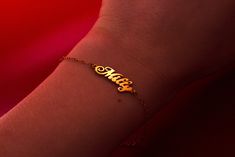 This personalized name bracelet, made of 14k gold, is a perfect dainty gift for mom. Ideal as a personalized jewelry birthday gift, this elegant name bracelet adds a touch of sophistication to any occasion. 𝐃𝐄𝐓𝐀𝐈𝐋𝐒 💎 1 name bracelet, included 💎 Material: 14k Solid Gold  💎 Length: Small, Medium or Large 💎 Finish: Polished 𝐇𝐎𝐖 𝐓𝐎 𝐎𝐑𝐃𝐄𝐑 1. In the "Personalization Field", enter the name to be engraved 2. Select the bracelet length 4. Select desired shipping method  𝐘𝐎𝐔 𝐌𝐈𝐆𝐇𝐓 𝐀𝐋𝐒𝐎 𝐋𝐈𝐊𝐄 💎 https://www.etsy.com/shop/RUMJewelry?section_id=47032677 💎 https://www.etsy.com/listing/755198568/evil-eye-ring-gold-evil-eye-ring-with?click_key=7f668b2e02e1e4fc060be1fd5285cbac38f836bb%3A755198568&click_sum=463ed137&ref=shop_home_active_42&pro=1&frs=1 𝐒𝐇𝐈𝐏𝐏𝐈𝐍𝐆 Sh Dainty Nameplate Bracelet For Personalized Gift, Dainty Customizable Name Bracelet For Personalized Gift, Classic Name Bracelet For Mother's Day Gift, Customizable Dainty Name Bracelet For Personalized Gift, Customizable Dainty Name Bracelet, Dainty Customizable Name Bracelet, Classic Customized Name Bracelet As Personalized Gift, Classic Customized Name Bracelet For Personalized Gift, Dainty Engraved Name Bracelet For Personalized Gift