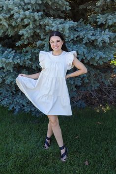 This dress could not be more perfect for summer. We love a neutral dress around here that pairs with absolutely everything! You would not believe the quality of this dress. I wish you could reach through the screen and feel it right now. Just take my word for it. Unreal ruffle sleeves with the cutest tiers AND pockets. Running true to size. Malorie is 5'6" and wearing a size medium. Casual Dresses With Ruffle Sleeves, Spring Sundress With Ruffle Hem And Flutter Sleeves, Spring Sundress With Flutter Sleeves, Spring Sundress With Flutter Sleeves And Ruffle Hem, Casual Butterfly Sleeve Dress With Ruffle Hem, Vacation Mini Dress With Ruffle Sleeves, Casual Dresses With Flutter Sleeve And Ruffle Hem, Casual Tiered Dress With Flutter Sleeves, Casual Ruffled Dress For Garden Party