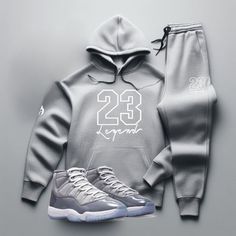 Yo, you looking for the freshest, most comfortable gear that perfectly matches your kicks? Check out our "23 Legend" Grey Sneaker Sweatsuit To Match Air Jordan Retro 11 Cool Grey colorway! So don't wait. Cop now and step up your game with our FIRE! "23 Legend" Men's Grey Sneaker Sweatsuit To Match Air Jordan Retro 11 Cool Grey. With fast shipping, hassle-free returns, and on-point customer service, Threads On Fire is the only choice for real sneakerheads who demand the FIRE! Check out our Sneake Fall Outfits Men Streetwear, Grey Tracksuit, Air Jordan Retro 11, Outfits Men Streetwear, Jordan Retro 11, Grey Hoodie Men, Jordan Shoes Retro, Retro 11, Black Men Street Fashion