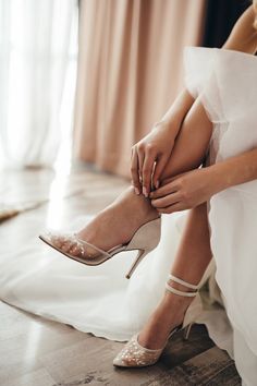 Luxury Wedding Shoes With Wrapped Heel And Almond Toe, Luxury Chic Wedding Shoes With Almond Toe, Chic Luxury Wedding Shoes With Almond Toe, Luxury Cream Wedding Shoes For Summer, Luxury Cream Wedding Shoes For Spring, Luxury Romantic Wedding Shoes For Ceremony, Luxury Embellished Cream Wedding Shoes, Luxury Almond Toe Shoes For Wedding Reception, Luxury Chic Wedding Shoes For Spring