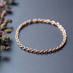 This dainty beauty is crafted from solid 14k Gold cable chain. A perfect wedding ring, knuckle ring, thumb ring it also makes for a lovely piece of jewelry to gift to your bridesmaids and BFFs. SIZING: Since it is a chain ring, WE SIZE HALF A SIZE UP on the ring size you select. Please select your actual ring size. Note: Chain rings tend to stretch with time. Avoid Each ring is hand crafted, finished and made to order. Hence, they may have slight variations. These aren't flaws, they add to the u Tragus Gold, Gold Chain Ring, Dainty Wedding Band, Dainty Wedding, Gold Rings Simple, Yellow Gold Wedding Band, Tragus Earrings, Solid Gold Chains, Thumb Ring