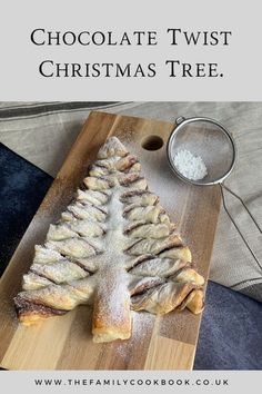 chocolate twist christmas tree on a wooden cutting board with powdered sugar in the middle