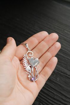 ITEM DESCRIPTION: The size H 5 cm x W 3 cm (2 x 1 inch). Weight - 4 g. You can buy it with a silver chain or without it. I made this unique Crocus pendant of sterling silver, dark amethyst, and moonstone. This is similar to the first spring flowers that appear from under the snow. The floral necklace looks so gentle and elegant! This handmade necklace will come to you in a gift box - ready for gifting. The parcel will be sent 1-2 days after payment. Delivery usually takes 10-21 days. But in the Metal Flower Jewelry As Gift, Flower Shaped Metal Jewelry As Gift, Flower-shaped Metal Jewelry As Gift, Sterling Silver Heart Pendant With Flower Charm Jewelry, Elegant Flower Shaped Large Pendant Jewelry, Elegant Flower-shaped Large Pendant Jewelry, Sterling Silver Heart Pendant With Flower Charm, Sterling Silver Heart Pendant Necklace With Flower Charm, Elegant Floral Large Pendant Jewelry