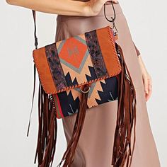 Unleash Your Bohemian Spirit Discover the perfect blend of style, comfort, and bohemian flair with our Vintage Boho Tassel Shoulder Bag. Exquisitely crafted with a vibrant patchwork of canvas and PU leather, this bag is not just an accessory but a statement of your unique style. Whether you're navigating the urban jungle or exploring quaint cobblestone streets, this bag is your ideal companion. Detailed Craftsmanship Originating from the skilled artisans of GUANG DONG Province, each bag showcase Cardigan Sweater Vest, Cobblestone Streets, Bohemian Design, Tassel Fringe, Urban Jungle, Bohemian Chic, Ladies Tops Fashion, Buy Vintage, Vintage Boho