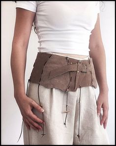 Leather corset belt, tribal leather belt, leather corset belt, nubuck festival belt, tribal belt, bohemian leather belt,barbrian belt and bag First of all, welcome! I would like to introduce a useful and ostentatious handmade nubuck leather set that has both sports and classic uses. Genuine leather and stainless metal accessories tanned by herbal methods are used in this belt and bag without using chemicals. Due to the fact that it takes a porous and breathable material   does not cause allergie Leather Corset Belt For Festivals, Medieval Style Corset Belt For Festivals, Medieval Corset Belt For Festivals, Medieval Corset Belt For Larp With Belt Loops, Leather Steampunk Corset Belt For Festivals, Steampunk Leather Corset Belt For Festivals, Bohemian Belt Bag With Belt Loops For Festivals, Brown Belt Bag For Festival, Brown Corset Belt For Festivals