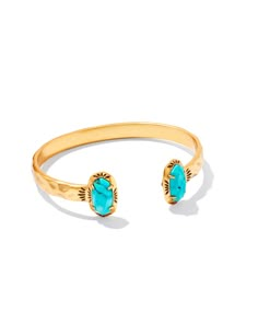 The cuff style you know and love gets a Western-inspired spin in the Elton Vintage Gold Etch Frame Cuff Bracelet in Variegated Turquoise Magnesite. Our signature bookended stone cuff is embellished with an etched frame inspired by tooled designs on leather saddles. It’s the handcrafted touch your stack needs and the perfect way to add personality to any look. This bracelet is a part of Yellow Rose by Kendra Scott—a brand that celebrates ranch life with Kendra Scott staples alongside select curated jewelry pieces and accessories. Metal Vintage 23k Yellow Gold Over Brass Material Variegated Turquoise Magnesite Closure Adjustable Size 2.28" Inner Diameter, 0.7"L X 0.5"W StationsDue to the one-of-a-kind nature of the medium, exact colors and patterns may vary slightly from the image shown. | K Kendra Scott Cuff Bracelet, Turquoise And Gold, Turquoise Jewelry Gold, Short Pendant Necklace, Wrist Accessories, Bar Jewelry, Initial Jewelry, Engraved Jewelry, Gold Fashion