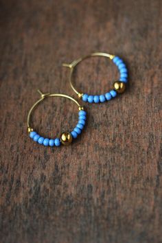 Lovely summer hoop earrings with "forget me nots" blue color glass seed beads, gold tone stainless steel beads and gold tone stainless steel round hoop earrings. Earring hooks are from nickel free and lead free metal. Perfect jewelry for everyday wear or a great gift for someone special! Diameter of hoops is 25 mm. Other earrings of my shop you can see here: https://www.etsy.com/shop/NaTavelli?section_id=13757927 Thanks for visit. Blue Beaded Round Hoop Earrings, Handmade Blue Beaded Hoop Earrings, Blue Beaded Small Hoop Earrings, Handmade Blue Beaded Small Hoop Earrings, Blue Beaded Small Hoop Jewelry, Blue Hoop Earrings With Ear Wire, Blue Everyday Jewelry For Summer, Blue Everyday Summer Jewelry, Everyday Blue Summer Jewelry