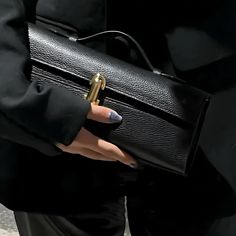 ✨ Elevate your evening look with our Elegant Leather Clutch Bag, the epitome of sophistication and style. Crafted from premium genuine leather, this luxurious small tote combines timeless design with a touch of modern minimalism. Its sleek silhouette is perfect for any night out, adding an effortlessly chic vibe to your ensemble. 💼 Bag Size: 27cm Length x 11cm Height x 7cm Width (10.6" x 4.3" x 2.8") 🌟 Key Features: Material: Genuine Leather 🧵 Top Handle Design: Easy to carry, perfect for both casual and formal occasions. Versatile Styles: Available in Olive Green, Black, and White to match any outfit. Secure Closure: Ensures your essentials are safe while looking stunning. Whether you're heading to a special event or simply stepping out for the evening, this stylish leather handbag wil High-end Evening Bag With Removable Pouch, Luxury Black Baguette Bag With Rectangular Case, High-end Clutch For Daily Use As Shoulder Bag, Modern Clutch Baguette Bag For Party, Office Clutch With Detachable Handle And Rectangular Shape, Office Clutch With Detachable Handle, Evening Handheld Bag With Hasp Closure, Formal Top Handle Mobile Phone Bag, Handheld Evening Bag With Hasp Closure