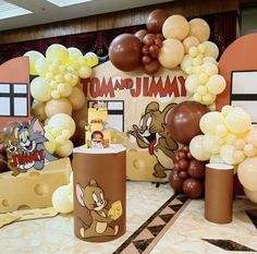 an assortment of balloons and decorations at a birthday party