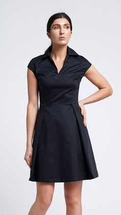 A mini shirt dress featuring mini length, pleated skirt and straight collar. - short cap sleeves  - straight collar - pleated skirt - mini length - two pockets in side seams - concealed back zipper closure Fiber: 95% cotton, 5% elastane Color: black For size 2 US / 36 EU: dress length - 36" (92 cm) Our model wears size 2 US and is 176 cm / 5'9" tall. You may feel free choosing the size. Just send us your measurements (bust, waist, hips, height). We will define your correct size.  MORE DRESSES: h Classic A-line Cotton Shirt Dress, Elegant Pleated Cotton Mini Dress, Casual Collared Dress With Pleated Waist, Solid A-line Dress With Pleated Waist, Solid A-line Pleated Dress, Formal Short Sleeve Shirt Dress With Pockets, Black Short Sleeve Dress With Pleated Hem, Black Dresses With Pleated Hem And Short Sleeves, Pleated Waist Mini Dress For Work