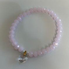 This Is A Very Pretty Pale Pink Bracelet To Wear Alone Or For Stacking. Hand Made With Stretchy Cord To Fit Most Wrists. No Tags But Brand New. Check Out My Other Bracelets To Bundle & Save On Shipping. Heart-shaped Bracelets With Faceted Beads For Gifts, Heart Shaped Bracelets With Faceted Beads For Gifts, Heart-shaped Bracelet With Faceted Beads For Gifts, Heart-shaped Faceted Beads Bracelet Gift, Pink Heart Crystal Bracelet With Heart Beads, Adjustable Crystal Heart Bracelet With Charm, Adjustable Heart Crystal Bracelet With Heart Charm, Elegant Stretch Bracelet With Heart Charm, Elegant Beaded Heart-shaped Stretch Bracelet