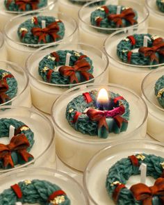 many small candles with bows on them