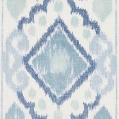 a blue and white pattern on fabric