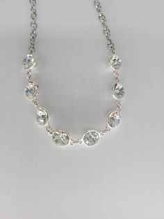 "Unique glass crystal charm Necklace with a silver chain. Great for gifts for weddings bride bridesmaids mothers day or just to say your special. Has a 3\" extension with a lobster claw clasp.  Measurements: chain 18\" charms 1/4\" extensions 3\"" Silver Necklace With Rhinestones For Gift, Sparkling Rhinestone Necklace For Gift, Sparkling Rhinestone Necklace For Anniversary, Nickel Free Clear Jewelry For Party, Sparkling Crystal Rhinestone Necklace Gift, Silver Sparkling Rhinestone Necklace For Gift, Dazzling Metal Rhinestone Necklace For Gift, Nickel-free Clear Jewelry For Parties, Dazzling Rhinestone Necklace As Gift