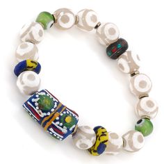 The Eye of Colors Bracelet is a beautiful piece of jewelry that is handcrafted using a variety of high-quality materials. The bracelet features White Nepal Agate stone beads, which are known for their calming and grounding properties. These beads are paired with Handmade paintings African beads, which add a pop of color and texture to the bracelet. The green evil eye beads are believed to provide protection against negative energy and promote good luck and prosperity. The Eye of Colors Bracelet Green Evil Eye, Protection Against Negative Energy, Handmade Paintings, Evil Eye Beads, Hematite Stone, White Agate, Eye Beads, African Beads, Colorful Bracelets