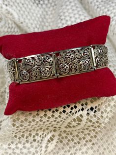 Beautiful bracelet from the 1920-30s that is in mint condition. Marked with Sterling and Germany. Pictures do not do this gorgeous bracelet justice. 19.6 grams and 7 1/4 inches in length. Has a safety lock. Very Art Deco. Classic Metal Bracelet With Intricate Design, Classic Metal Bracelets With Intricate Design, Classic Sterling Silver Bangle With Intricate Design, Antique Sterling Silver Bracelets With Intricate Design, Classic Sterling Silver Bracelet With Intricate Design, Classic Sterling Silver Bracelet With Intricate Design As Gift, Art Deco Bracelets With Intricate Design As Gift, Elegant Collectible Bangle With Intricate Design, Elegant Hallmarked Sterling Silver Bracelet For Ceremonial Use