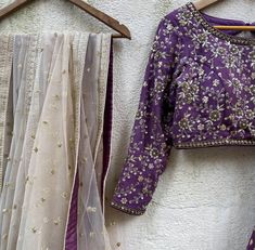 A three-piece aubergine lehenga set from the Priti Sahni collection. This georgette purple butti lehenga with gota work detail is paired with a dull gold blouse with bead and zardozi hand work embroidery. This outfit is completed with a nude dupatta in net material with sequin work. Elegant Purple Anarkali Set With Gota Work, Purple Anarkali Pre-draped Saree For Reception, Purple Gota Work Lehenga, Purple Lehenga With Gota Work, Purple Traditional Drape With Gota Work, Reception Purple Pre-draped Saree With Pallu, Designer Purple Choli With Gota Work, Purple Blouse Piece With Dupatta For Reception, Purple Sharara For Reception With Traditional Drape