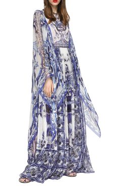 In its Blu Mediterraneo line, Dolce&Gabbana wants to emphasize the concept of beauty, lightness and femininity with the warm harmony of blue and white. Crafted of silk chiffon, the kimono-sleeve maxi dress is defined by large painterly prints and draped sides.Round neckLong sheer kimono sleevesConcealed back zip100% silkDry cleanMade in Italy Asymmetrical Sleeves, Majolica Print, Chiffon Kaftan, Long Chiffon Skirt, Print Chiffon Dress, Sheer Kimono, Chiffon Kimono, Marine Uniform, Floor Length Dress