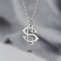 PLEASE NOTE: I am still be taking orders (both UK and International) and making jewellery from my garden studio with the utmost care and safety during these unprecedented times. A beautiful handmade solid sterling silver monogram necklace.Two initials are entwined to create your monogram, we then create the pendant from sterling silver. The initials could be the wearers initials, yours and her initials combined, or perhaps the children's initials.This beautiful, delicate necklace makes the perfe Formal Initial Pendant Necklace With Monogram, Formal Monogram Initial Pendant Necklace, Formal Monogram Initial Necklace, Classic Sterling Silver Initial Necklace For Personalized Gift, White Gold Initial Necklace For Anniversary, Classic Sterling Silver Monogram Necklace, Classic Monogram Initial Pendant Necklace, Elegant Silver Initial Pendant Custom Necklace, Elegant Silver Initial Pendant Necklace