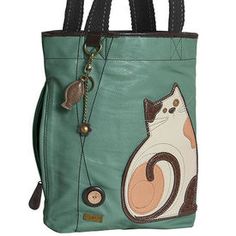 a green purse with a cat on it's front and side pocket, hanging from the handle