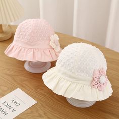 Charming Sun Protection for Your Little One Keep your baby girl safe and stylish with our Sweet Cute Baby Bucket Hat. This delightful sun hat is perfect for protecting your little one's delicate skin from harmful UV rays while adding a touch of charm to her outfit. Made from a blend of soft cotton and durable polyester, this hat is designed to provide comfort and breathability, making it ideal for sunny days spent outdoors. Features Our baby sun hat is designed with both functionality and style in mind. Here are some key features: Material: Soft and breathable cotton and polyester blend Color Options: Available in Pink, Yellow, and White Size: Fits babies with a head circumference of 17.3-18.9 inches (44-48 cm), suitable for ages 3-18 months Design: Adorable lace ruffle and flower detailin White Sun Hat With Uv Protection For Playtime, Cute Spring Sun Hat For Playtime, White Summer Sun Hat For Playtime, Cute Spring Playtime Sun Hat, Cute White Sun Hat With Uv Protection, Adjustable White Sun Hat For Playtime, Pink Sun Hat For Summer Playtime, White Spring Bucket Hat For Playtime, White Bucket Hat For Playtime In Spring