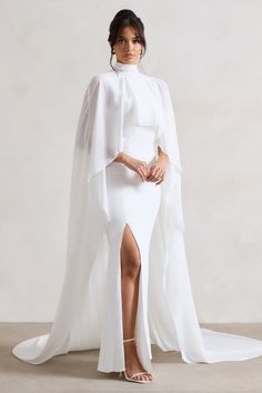 Saint Cream Fishtail Split Maxi Dress With Chiffon Cape – Club L London - USA Long Sleeve Cape Wedding Dress, Cape For Dress, Fish Tail Wedding Dress, Saint Dress, Winter Maxi Dress, Chiffon Cape, Dress With Cape, Brides Mom, Horse Races