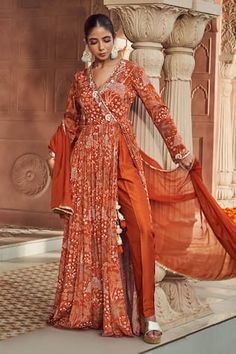 Rust orange anarkali with front slit, floral print and sequins hand embroidery. Comes with pant and a dupatta. - Aza Fashions Angarkha Anarkali, Angrakha Suit, Orange Anarkali, Angrakha Anarkali, Indian Anarkali, Floral Print Pants, Boutique Dress Designs, Desi Style, Stylish Sarees