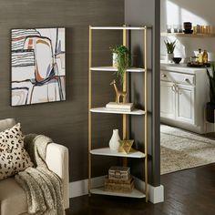 a living room filled with furniture and a painting on the wall next to a couch