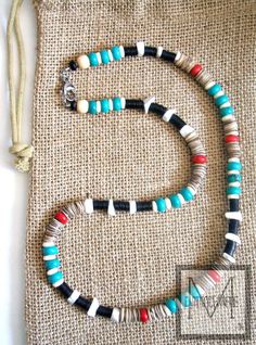 This Native American beaded necklace is designed with inspiration from the Eagle and freedom.  The colors and the shapes of the beads represent these inspirations. Blue turquoise  magnesite howlite, beige shell, and bone with accents of white howlite gemstone are incorporated and the black record beads add a modern look to the necklace. The beads are blended together in sequences like a painting. A touch of red finishes it off like an art piece. The power and freedom of the Eagle are depicted wi Native American Beaded Necklace, Native American Inspired Fashion, Wolf Tooth Necklace, Fire Jewelry, Men's Necklaces, Native American Photos, Gemstone Beads Jewelry, Southwest Jewelry, Native American Style