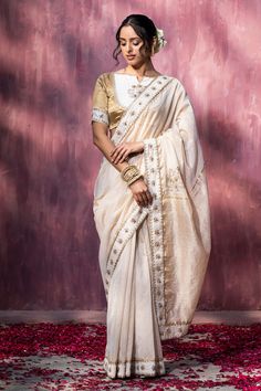 Off-white saree with thread, gota embroidery in floral pattern on border.
Components: 1
Pattern: Embroidery
Type Of Work: Thread, gota
Fabric: Chanderi
Color: Off White
Other Details: 
Note: Saree blouse worn by the model is not for sale
Occasion: Wedding - Aza Fashions Baluchari Saree, Off White Saree, Gota Embroidery, Dhakai Jamdani Saree, Weave Shop, Chanderi Sarees, Saree Women, Chanderi Saree, Chanderi Silk Saree