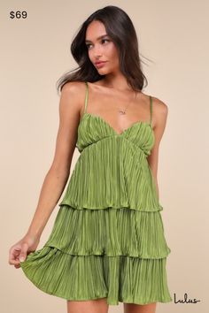 The undeniable party presence of the Lulus Sleek Dedication Green Satin Plisse Cutout Tiered Mini Dress means that it was made to own the dance floor! Luxe, plisse-pleated woven satin shapes this stunning dress that features a sleeveless bodice with an alluring V-neckline and adjustable spaghetti straps. The high, empire-style waist features trendy twin cutouts at the sides, all atop a tiered A-line skirt that finishes at a too-cute mini hem. Hidden back zipper/clasp. Fit: This garment fits true Cute Flowy Dresses, Tops Fall Outfits, Trendy Maxi Dresses, Beach Wedding Guest Dress, Fall Trends Outfits, Tiered Mini Dress, Green Mini Dress, Wedding Guest Dresses, Satin Mini Dress