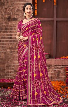 This Saree is Ready to Wear (With Fall and Pico Done). A designer saree in Magenta & Golden color. It has intricate design all over the saree. This saree is a suitable amalgamation of style and grace that is required from an ethnic wear. The saree is ideal for any formal gathering. The saree comes with an unstitched blouse of corresponding color and design as shown in the picture. Georgette Designer Magenta & Golden Color Saree Fabric Type: GeorgettePrimary Color: MagentaSecondary Color(s): - Go Festive Bandhani Print Georgette Pre-draped Saree, Semi-stitched Pre-draped Saree With Zari Weaving For Navratri, Bandhani Print Pre-draped Saree For Puja, Festive Semi-stitched Pre-draped Saree For Puja, Fitted Bandhani Print Saree For Puja, Georgette Saree With Bandhani Print In Traditional Drape, Georgette Saree With Bandhani Print, Festival Bandhani Print Blouse Piece, Festive Bandhani Print Saree Blouse Piece