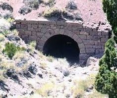 a tunnel in the side of a mountain